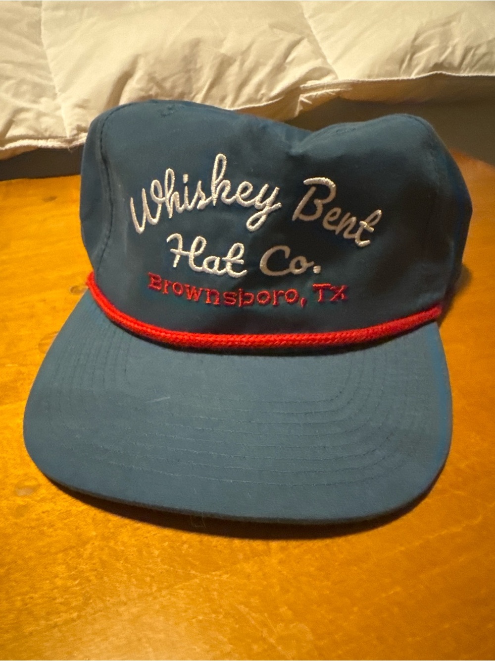 Blue Cap with Red Rope Trim